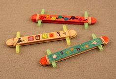 three wooden toys are laying on the floor