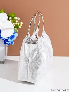 BagForLove - Metallic PU Mini Bucket Bag with Top Ring - Sleek and Stylish Product Description Color Silver Magnetic No Type Novelty Bag Bag Size Mini Style Glamorous Pattern Type Plain Strap Type Top Handle Closure Type No-closure Care Instructions Do not wash Material PU Size Chart INCH CM Bag Length Bag Width Bag Height Handle Height 7.1 inch 2.4 inch 4.7 inch 3.5 inch Bag Length Bag Width Bag Height Handle Height 18 cm 6 cm 12 cm 9 cm Details Pictures Similar Products h2 { text-align: center; } /* æ¢è¡ */ li{ white-space: normal; word-break: break-all; word-wrap: break-word; } .red-box { width: 100%; display: flex; flex-direction: row; flex-wrap: wrap; justify-content: center; } .red-box > div { width: 190px; height: 250px; margin: 10px; } .red-box > div > a > img { width: 190px; hei Silver Evening Bag With Detachable Handle For Shopping, Silver Party Bag With Round Handle, Handheld Evening Bag For Parties, Silver Clutch For Shopping, Prom Bag, Prom Purse, Mini Bucket Bag, Mini Bucket Bags, Mini Bucket