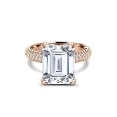 an emerald cut diamond engagement ring with pave set shoulders