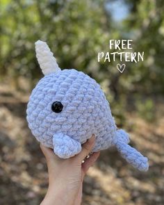 a hand holding up a crocheted stuffed animal with the words free pattern on it