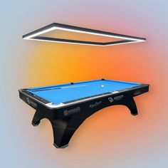 a pool table with a light above it and an image of a billiard on the wall behind it