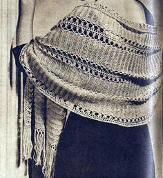 an old photo of a woman wearing a knitted shawl with tassels