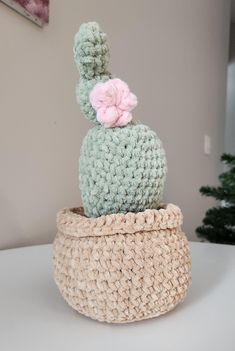 Calling all plant lovers! This handmade crochet cactus plush makes the perfect gift for anyone who wants a beautiful plant without any upkeep. Made using super soft yarn and available in 2 styles, this cute cactus will never desert you. Made using 100% polyester Big Twist Baby Bear yarn.  Cactus with pink flower measures approximately 6" in length, 6" in width, and 11" in height. Barrel cactus measures approximately 5" in length, 5" in width, and 10" in height. Pattern Credit: Hookok Yarn Cactus, Cactus With Pink Flower, Crochet Birthday Gifts, Cactus En Crochet, Crochet Birthday, Fake House Plants, House Plant Decor, Barrel Cactus, Crochet Cactus