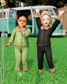 two dolls are standing in the grass with their hands up and one is wearing leopard print