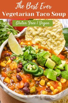 the best ever vegetarian taco soup in a bowl with tortilla chips