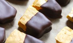 chocolate and peanut butter squares are arranged on a baking sheet, ready to be eaten