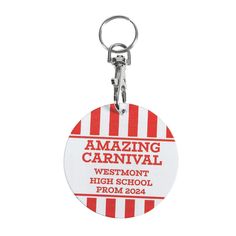 a red and white striped keychain with the words amazing carnival written on it