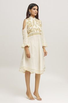 Cream dress with floral embroidered yoke, stripe embroidery on the sleeves and hemline. - Aza Fashions Spring Festive Dress With Embroidered Hem, Spring Off White Dresses With Resham Embroidery, Fitted Kurta With Embroidered Sleeves For Spring, Festive Cotton Dress With Embroidered Hem, Festive Cotton Dress With Embroidered Sleeves, Festive Embroidered Hem Dress, Elegant Festive Dresses With Embroidered Hem, Summer Festive Dress With Embroidered Sleeves, Spring Off-white Dress With Resham Embroidery