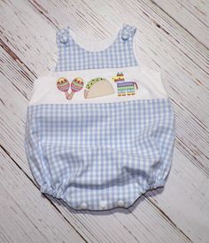 Baby Fiesta Bubble Romper, Blue Gingham Romper, Cinco de Mayo Outfit handmade by Sew Very Sweet  Embroidery features maracas, taco, and pinata Inside of the Romper the seams are on the inside, so no seems are visible and finished for a professional look.  The fabric is gingham and lined with basic white Cotton.  The crotch has snaps for easy changing.  The legs have elastic inside casing to not touch skin. Measurements for the Romper: Are based on average child sizing for US Measurements can be Sweet Embroidery, Gingham Romper, Baby Bubble Romper, Dry Air, Baby Bubble, Kona Cotton, Bubble Romper, Unisex Baby Clothes, Gender Neutral Baby Clothes