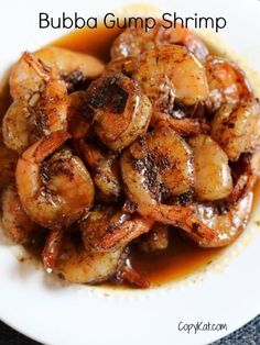 cooked shrimp with sauce on a white plate