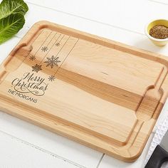 a personalized cutting board with the words merry christmas on it