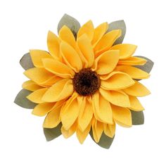 a large yellow flower with green leaves on it's center and two brown centers