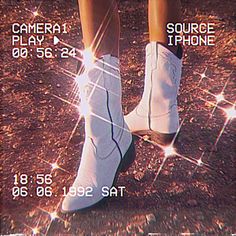 the legs and ankles of a person wearing white socks with text on them that reads, camera play iphone