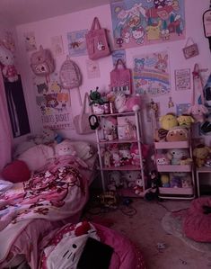 a pink bedroom with hello kitty pictures on the wall and other stuff animals in it