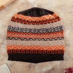 This captivating winter hat features bold geometric patterns and fabulously bright tangerine, vanilla, graphite and black hues. Peruvian artisan Maritza Pacori's fashionable design is hand-knit from baby alpaca wool, making it an exceptionally cozy and stylish addition to your cold-weather wardrobe. Multicolor Alpaca Bohemian Hats, Handmade Cozy Alpaca Hats, Warm Alpaca Beanie, Winter Alpaca Beanie Cap, Blue Beret, Geometric Accessories, Alpaca Hat, Alpaca Beanie Hat, One Size, Gray Accessories