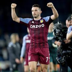 a soccer player is celebrating his team's victory