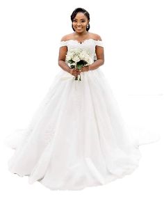 a woman in a white wedding dress holding a bouquet and posing for the camera with her hands on her hips