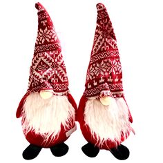 two red and white christmas gnomes are facing each other