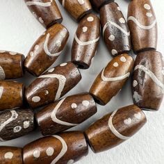 A short strand of hand carved and painted bone beads from India 11 beads 8" strand 10x17mm on average 2mm hole Carved Bone, Bone Beads, Bone Carving, Halloween Shopping, Bones, Seattle, Hand Carved, Carving, United States