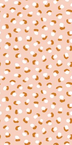 an orange and white pattern on a pink background, with small dots in the middle