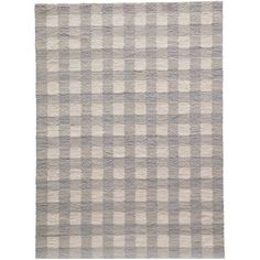 a gray and white checkered rug on a white background with an area rug in the middle