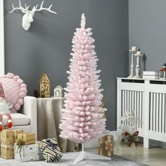 a pink christmas tree in a living room