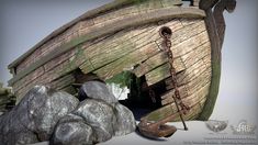 an old wooden boat sitting next to some rocks and a chain on the end of it