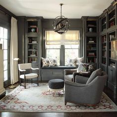 a living room filled with furniture and bookshelves