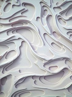 a close up view of an intricately designed wallpaper with wavy lines and curves