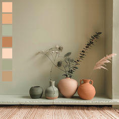 three vases are sitting on a shelf in front of a wall with color swatches