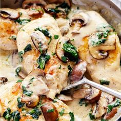 a pan filled with chicken and mushrooms covered in gravy