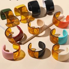 Trendy Handmade Plastic Bracelets, Handmade Yellow Cuff Bracelet, Trendy Adjustable Green Cuff Bracelet, Trendy Colorful Plastic Bracelets, Trendy Black Plastic Bracelets, Trendy Colorful Plastic Bracelet, Trendy Summer Bangle Jewelry, Trendy Multicolor Party Bangle, Trendy Plastic Bangle Bracelets