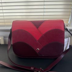 Never Been Used And Still With Original Stuffing. In Great Condition Leather Bag. Red Crossbody Flap Bag, Chic Red Saddle Bag With Detachable Strap, Chic Red Saddle Bag With Adjustable Strap, Chic Red Saddle Shoulder Bag, Kate Spade Burgundy Bags For Everyday Use, Kate Spade Burgundy Leather Bag, Red Tote Flap Bag With Removable Pouch, Red Crossbody Flap Bag For Shopping, Red Crossbody Flap Bag With Adjustable Strap