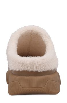 Genuine shearling at the lining and trim enhances the cozy comfort of a suede slipper grounded by a lug sole for added durability. 1 1/2" heel; 1" platform Leather upper/genuine-shearling (China) lining/synthetic sole Imported Shearling Slippers, Suede Slippers, Lug Sole, Comforters Cozy, Womens Slippers, Leather Upper, Slippers, Limited Edition, Nordstrom