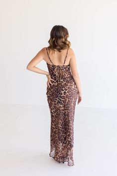 Get ready to pounce on style in the Rebecca Midi Dress. With its playful leopard print and sassy sleeveless design, this dress is perfect for date night. Don't forget the cowl neckline with back tie closure for an extra touch of charm. Style with strappy heels and a clutch. Details + Fit 100% Polyester Runs True to Size Hand Wash Cold Hang Dry Cowl Neckline Sleeveless Adjustable Shoulder Straps Back Tie Closure Side Zipper Closure Lined Leopard Print Design Brown | Multi | Printed Model is 5'2" Chic Sleeveless Leopard Print Dress, Chic Leopard Print Sleeveless Dress, Sleeveless Leopard Print Party Dress, Sleeveless Leopard Print Evening Dress, Leopard Print Fitted Maxi Dress For Date Night, Fitted Leopard Print Maxi Dress For Date Night, Chic Leopard Print Dresses With Spaghetti Straps, Ruched Leopard Print Dress For Party, Leopard Print Ruched Dress For Night Out