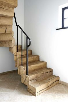 a set of stairs with wooden treads in a house