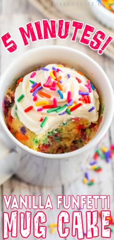 a cup filled with vanilla frosting and sprinkles on top of it