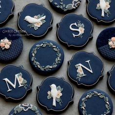 decorated cookies are arranged on a table