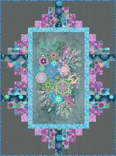 a quilted square with flowers and leaves on it's center, as well as the border