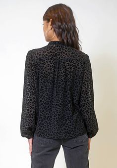 This sheer blouse features puffed sleeves and a tie neck detail. A velvet textured cheetah print. Perfect for the holidays or for work! Model is wearing a S. Elegant Leopard Print Party Blouse, Elegant Leopard Print Blouse For Fall, Puffed Sleeves, Sheer Blouse, Tie Neck, Cheetah Print, Neck Tie, Puff Sleeve, Velvet