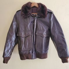 This jacket is very rare, have not seen another one like it from Harley-Davidson. It is in very good condition, made of brown leather, features a faux fur collar. This jacket shows little wear for its age, might have minor blemishes due to age and wear. See photos for more details. MEASUREMENTS: CHEST: 21 in. from armpit to armpit LENGTH: 26 in. from shoulders to bottom of jacket SLEEVES: 24.5 in. from shoulder seam to end of cuff BACK: 17.5 in. from shoulder seam to shoulder seam Retro Vintage Brown Biker Jacket For Fall, Retro Leather Outerwear For Winter, Retro Brown Leather Jacket For Fall, Retro Distressed Brown Leather Jacket For Fall, Vintage Leather Biker Jacket For Winter, Vintage Brown Retro Leather Jacket For Winter, Retro Leather Winter Outerwear, Retro Brown Leather Jacket For Winter, Retro Distressed Brown Leather Jacket For Winter