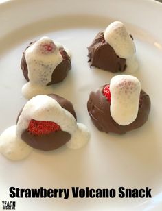 four chocolate covered strawberries are sitting on a white plate with the words strawberry volcano snack