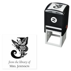 a black and white photo of a butterfly on a rubber stamp with the words from the library of mrs johnson