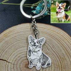 a keychain with a photo of a corgi dog on it's side