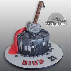 a cake with a hammer stuck in it