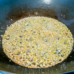 a frying pan with some food cooking in it