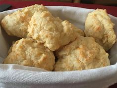 a basket filled with biscuits on top of a table