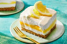 there is a piece of cake with lemon on the top and a fork next to it