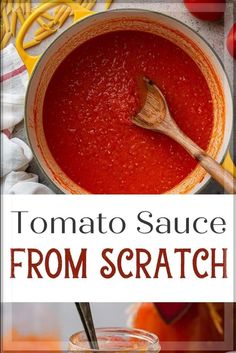 tomato sauce from scratch in a pot with a wooden spoon next to it and tomatoes on the side