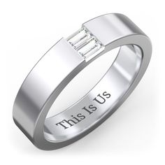 a ring with the words free engagement written on it and a baguette cut diamond